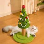 Cat playing with a Christmas tree-shaped cat toy on a wooden floor.