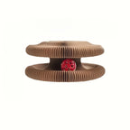 Brown pet toy with a red center on a white background