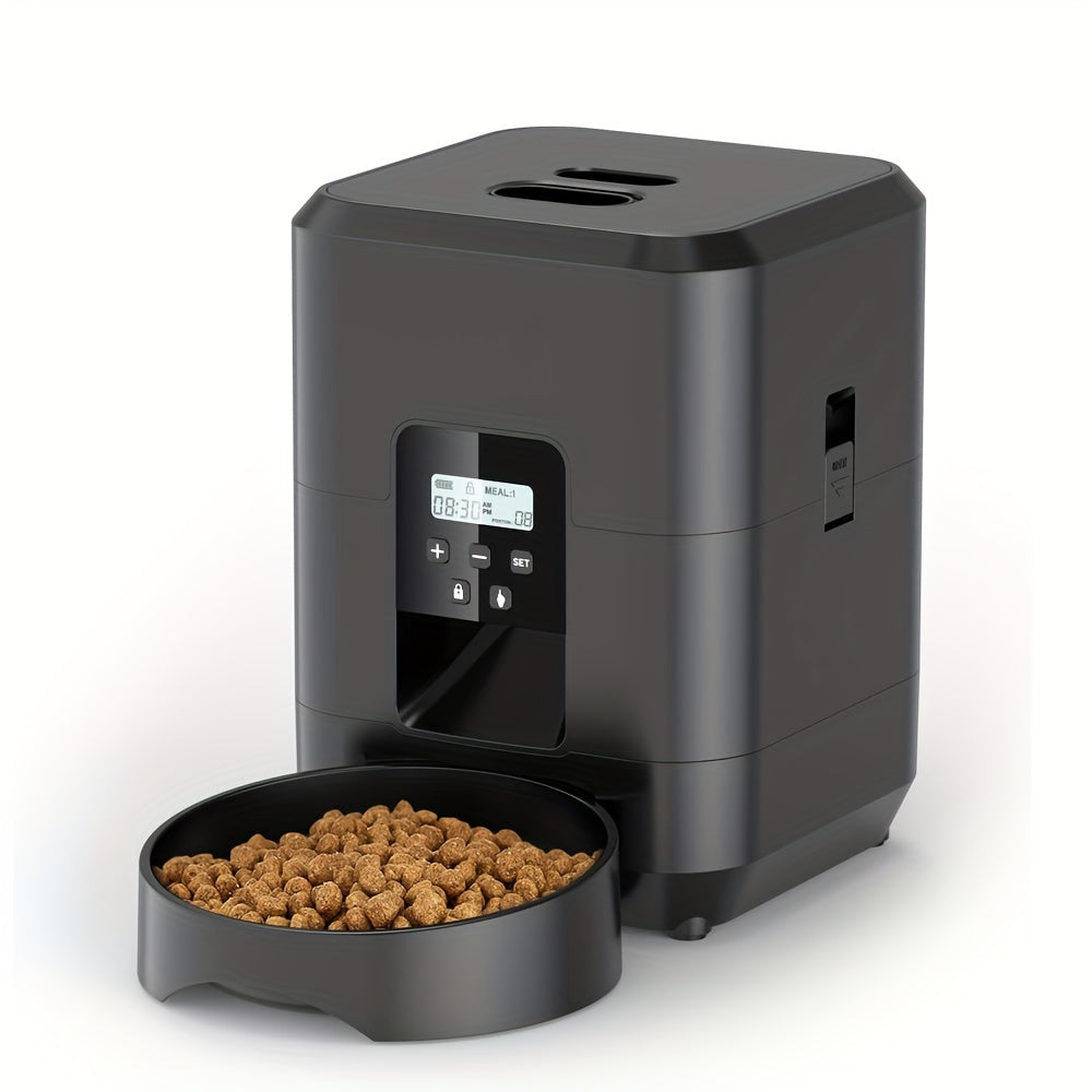 Black pet food dispenser with a bowl of kibble on a white background