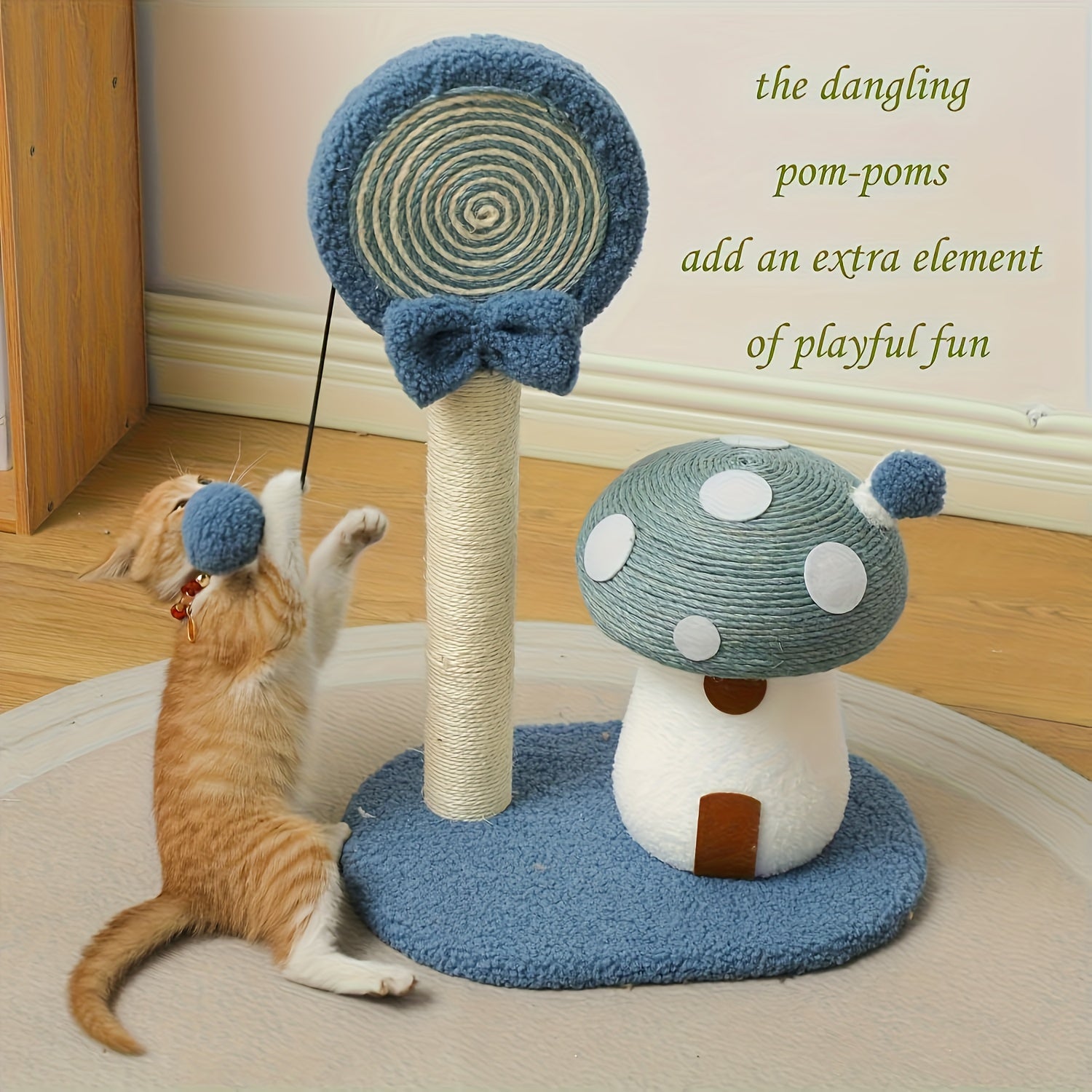 Cat playing with a blue and white cat tree with pom-poms on a wooden floor.