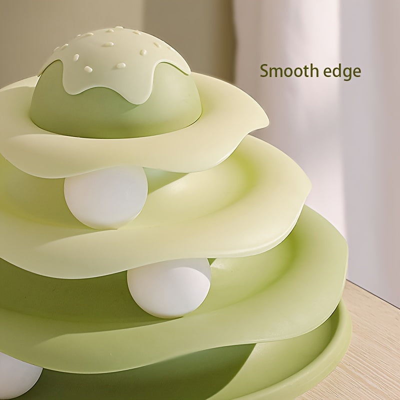 Green baby teething ring with smooth edges on a wooden surface