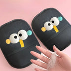 Two black cushion with cartoon face design on a pink background, showing hair removal results.