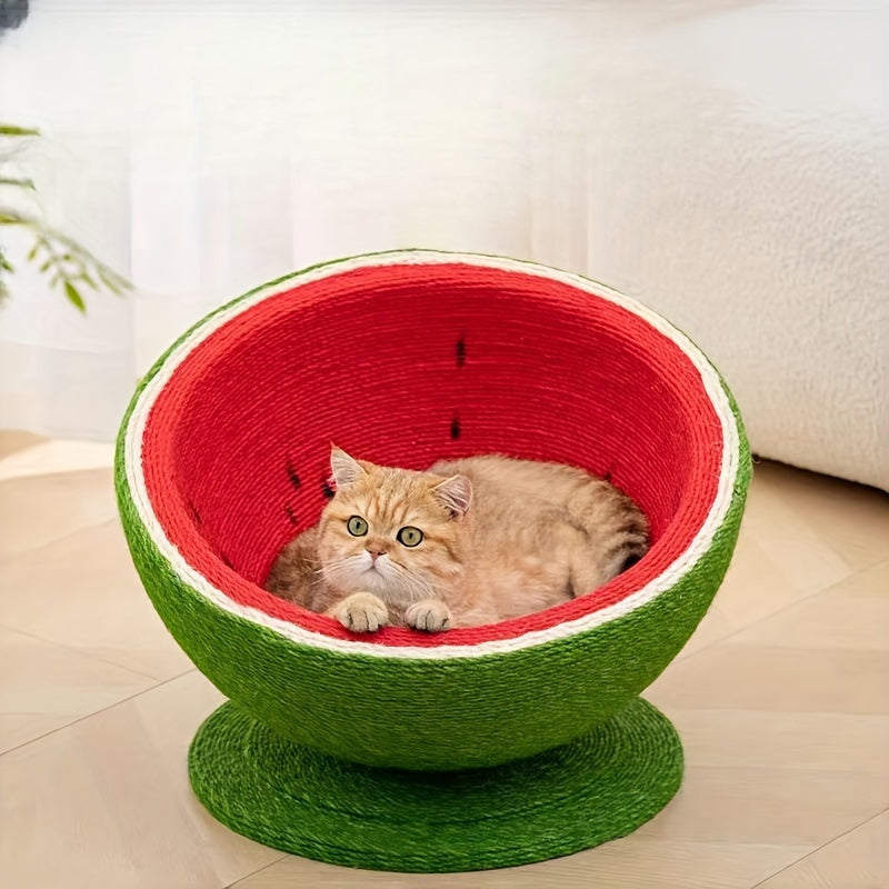 Cat lying inside a red and green pet bed on a light wooden floor.