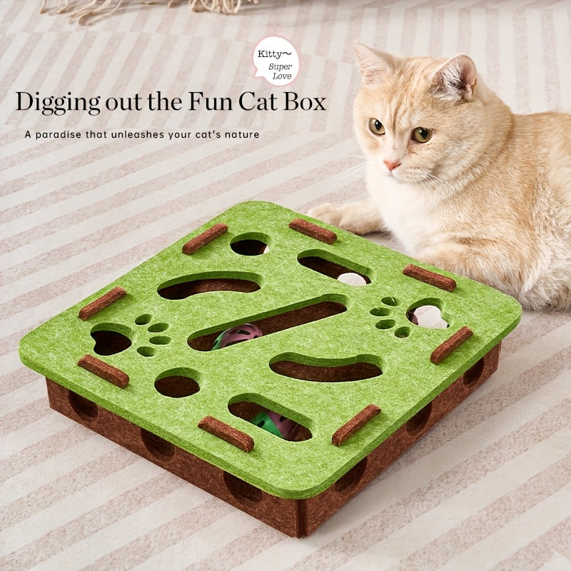 Cat playing with a green and brown cat toy on a striped surface
