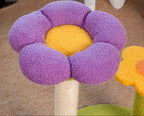 Flower-shaped soft fabric cushion on a wooden stand.