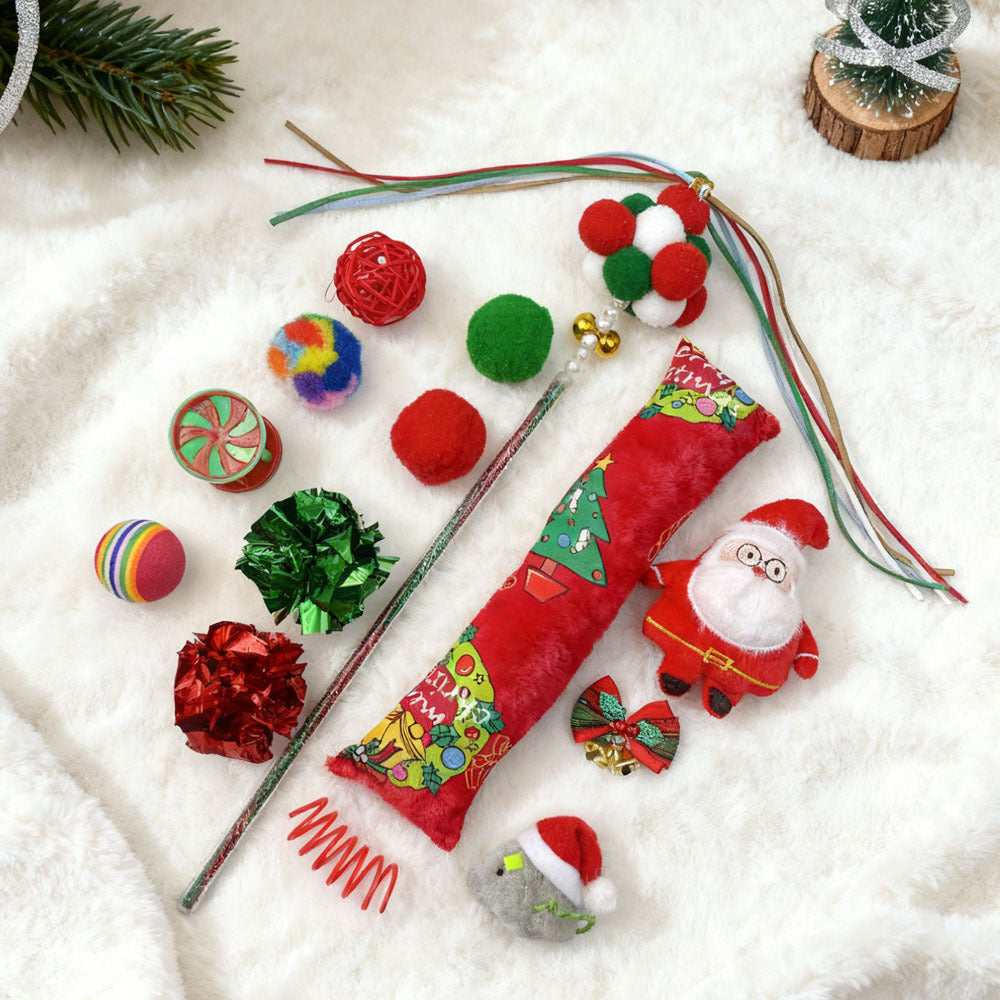 Collection of Christmas-themed pet toys on a snowy background