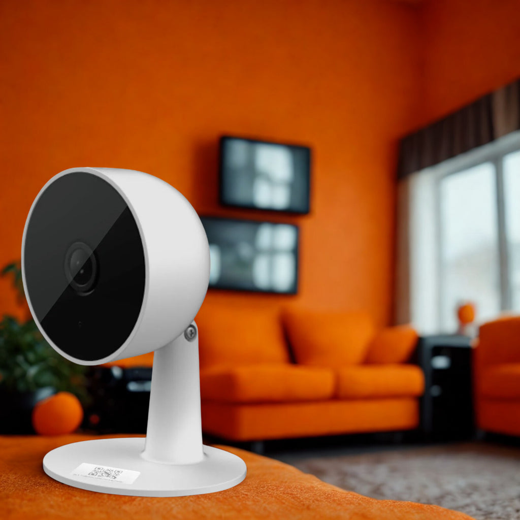 White security camera on a stand with an orange wall and furniture in the background