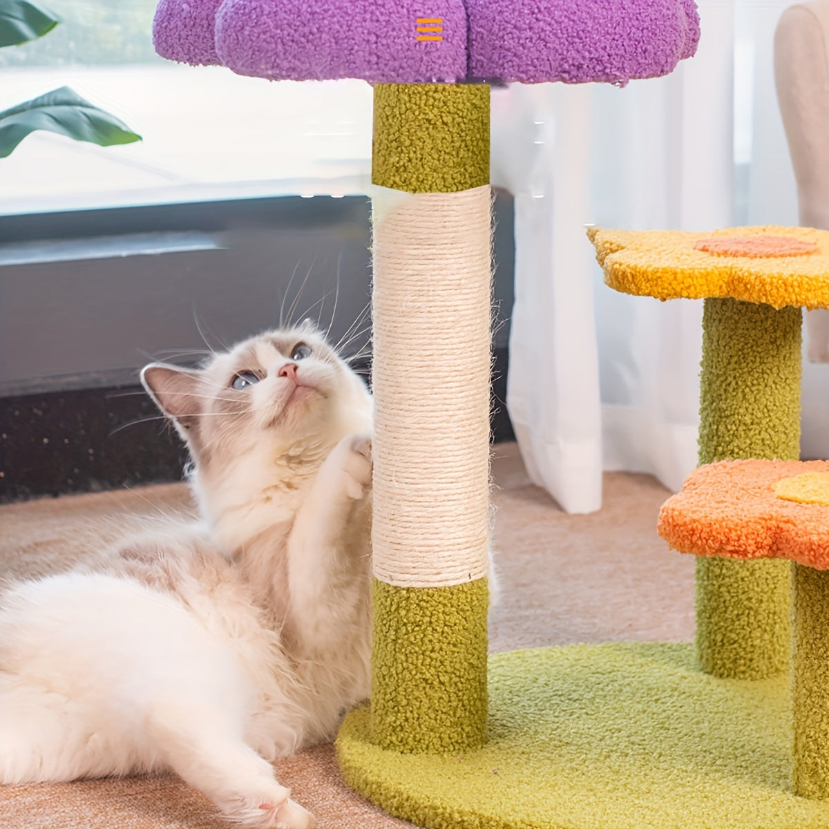 Cat playing with a colorful cat tree in a home setting