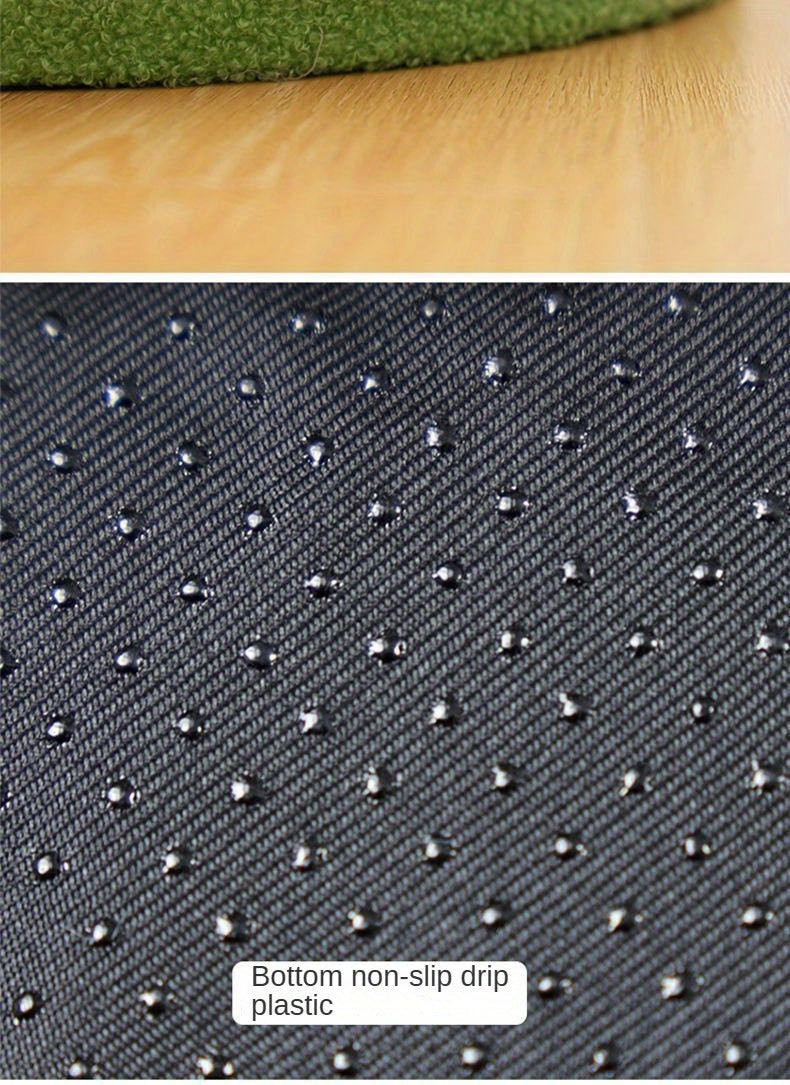 Textured black plastic sheet with non-slip surface on a wooden surface
