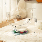 Clear cat-shaped pet bed with measurements on a soft surface