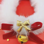 Decorative item with gold bell, white fur, and red ribbon on a red background