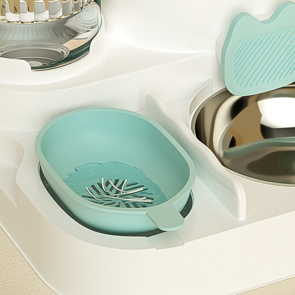 Teal pet bowl with a leaf design on a white surface