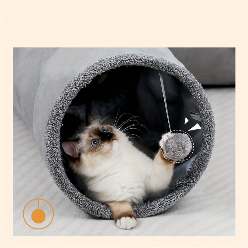 Cat playing with a toy inside a gray pet cave on a light background