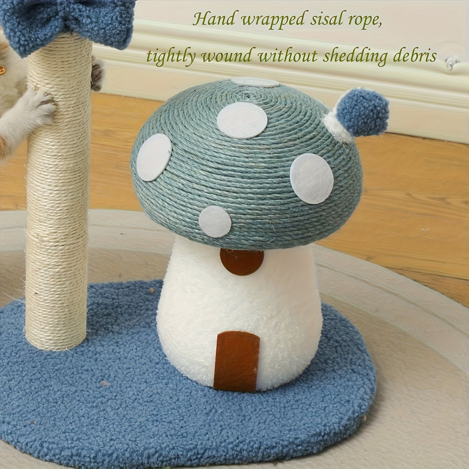 Cat toy shaped like a mushroom with sisal rope, placed on a blue mat.