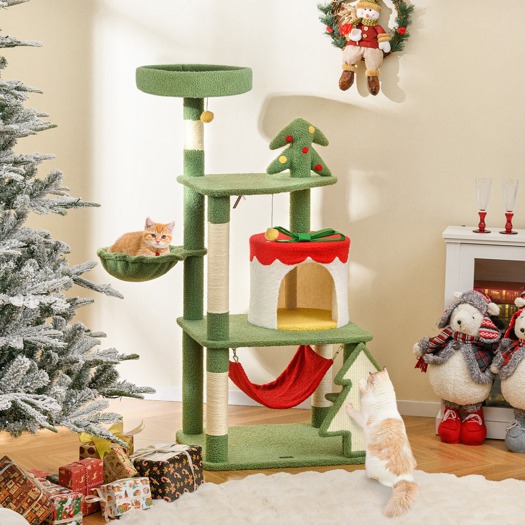 Green cat tree with cats in a festive living room setting.