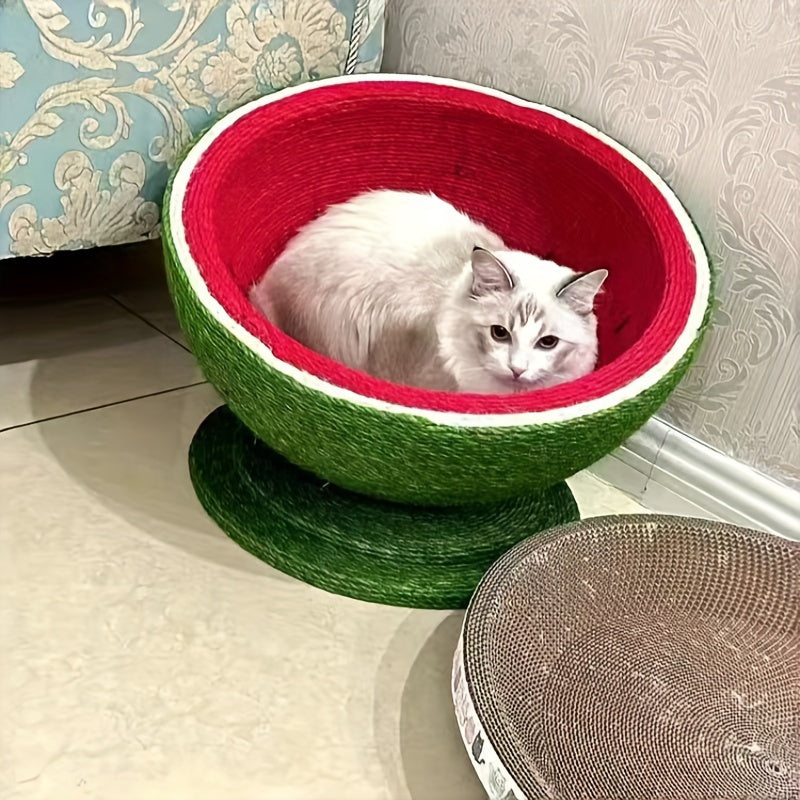 Cat lying in a green and red pet bed on a light-colored floor.