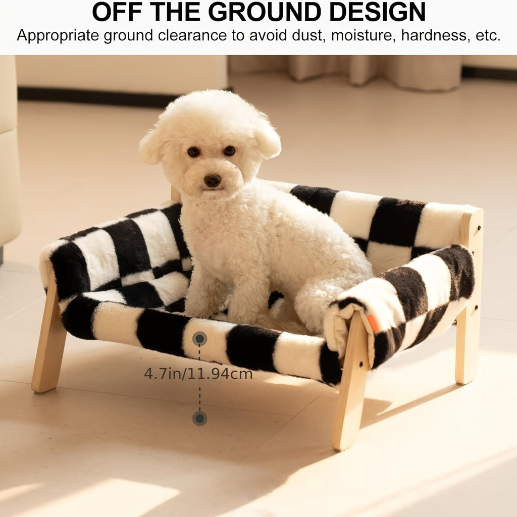 White dog sitting on a black and white checkered pet bed with text about ground clearance.