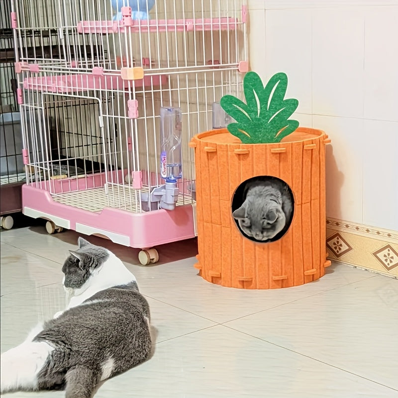 Cat playing with a carrot-shaped pet house next to a birdcage.