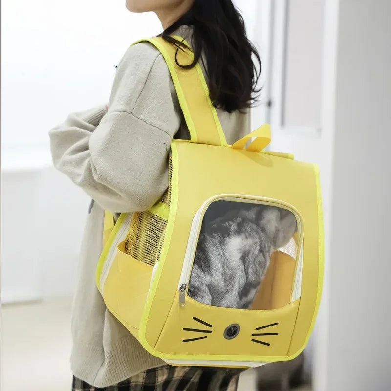 Person carrying a yellow pet carrier with a cat inside, set against a neutral background.