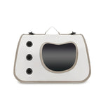 White pet carrier with a black interior on a white background
