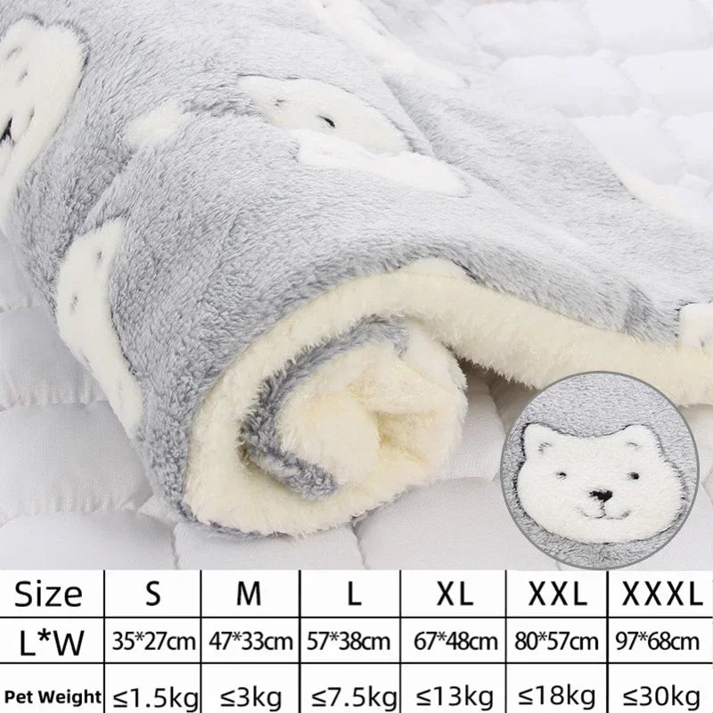 Fluffy white blanket with a bear design and size chart on a light gray background