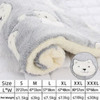 Fluffy white blanket with a bear design and size chart on a light gray background