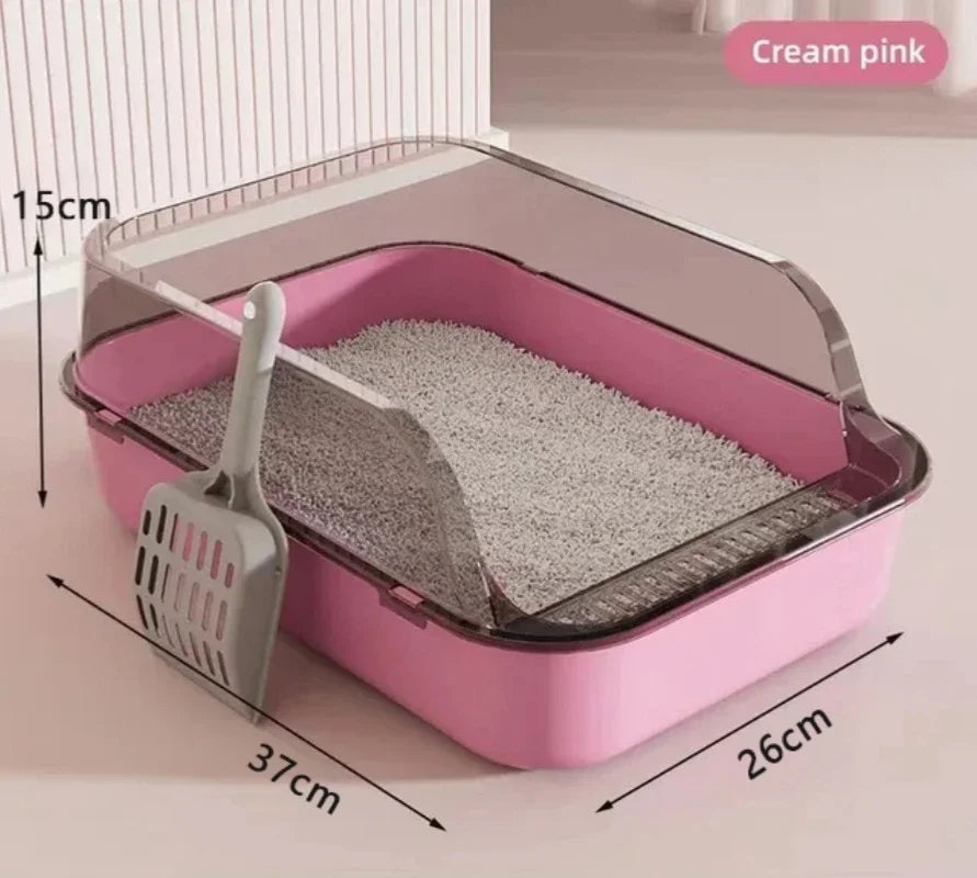 Pink cat litter box with dimensions and a scoop on a light background