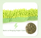 Green catnip toy with text indicating built-in paper catnip on a light green background