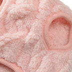 Close-up of pink fluffy material with a white background