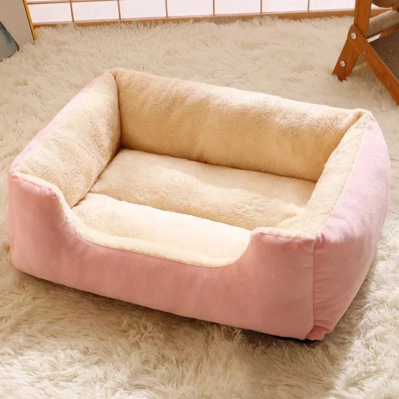 Pink and beige pet bed on a fluffy white rug