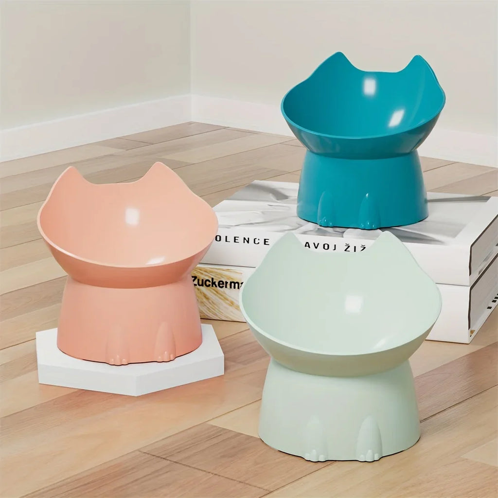 Three colorful cat-shaped stools on a wooden floor.