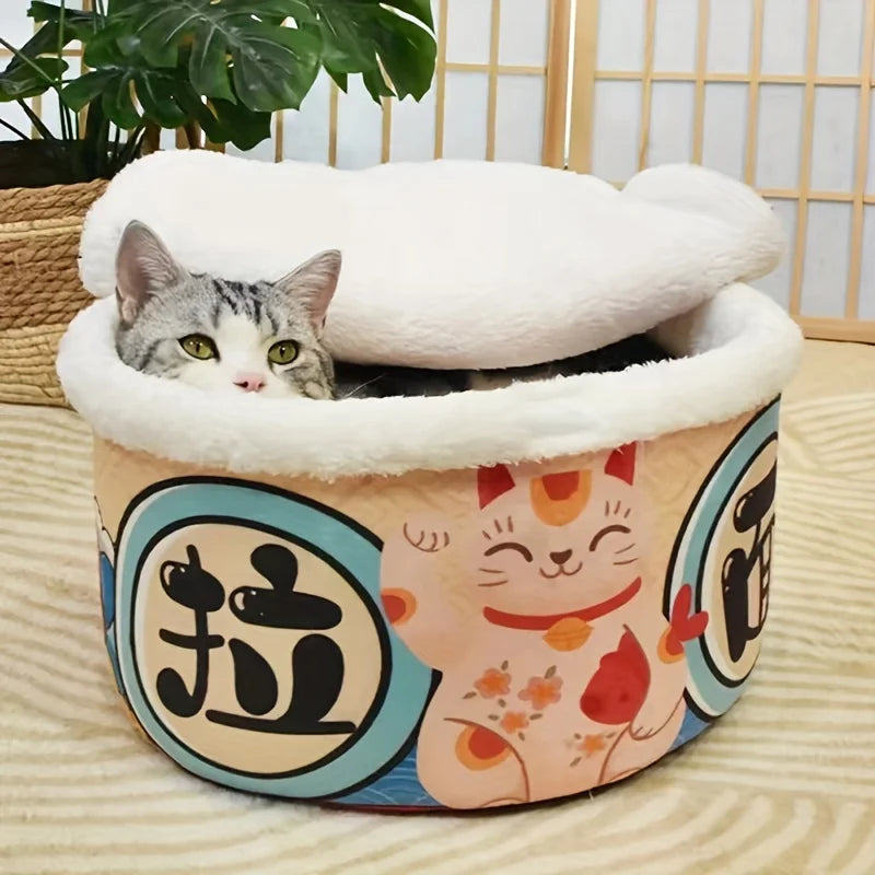 Cat peeking out from a colorful pet bed with cartoon designs on a wooden floor.