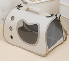 Pet carrier with mesh sides on a carpeted floor, featuring the HOMEFISH brand.