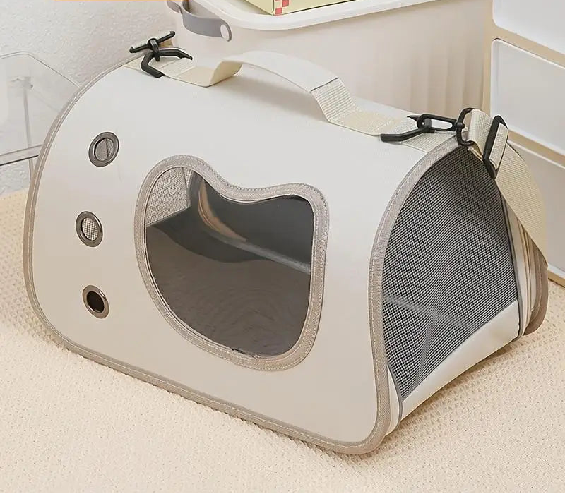 Pet carrier with mesh sides on a carpeted floor, featuring the HOMEFISH brand.