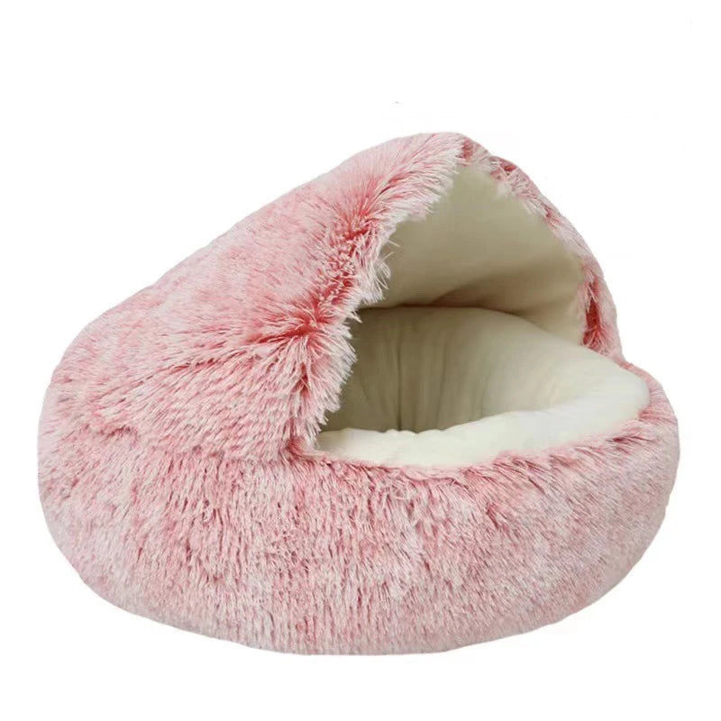 Pink fluffy pet bed on a white background
