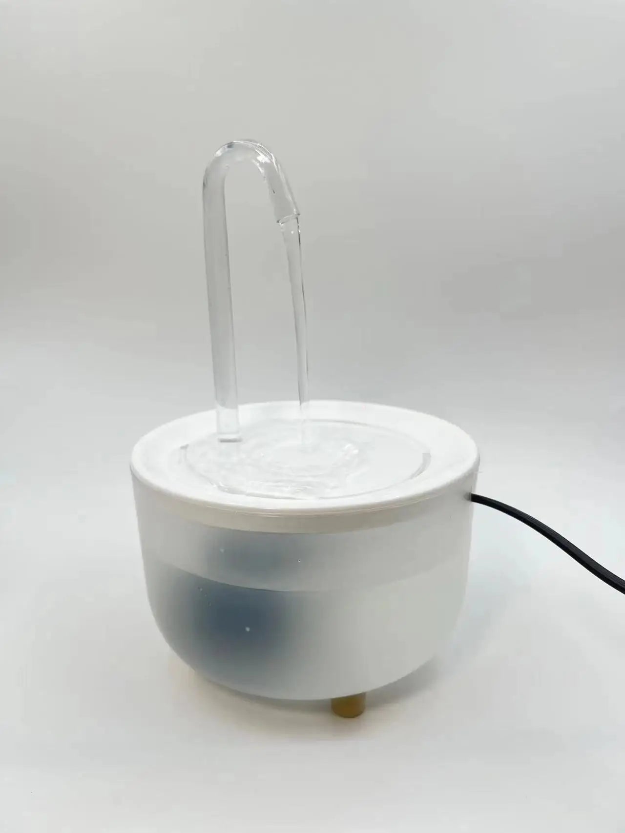 White electronic device with a clear tube on a white background