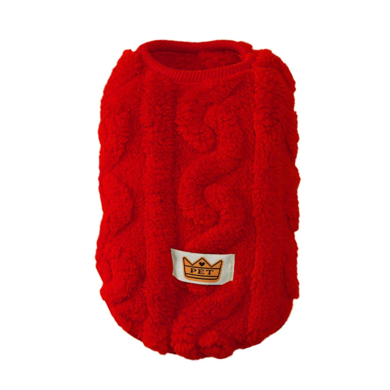 Red knitted dog sweater with a brand label on a white background