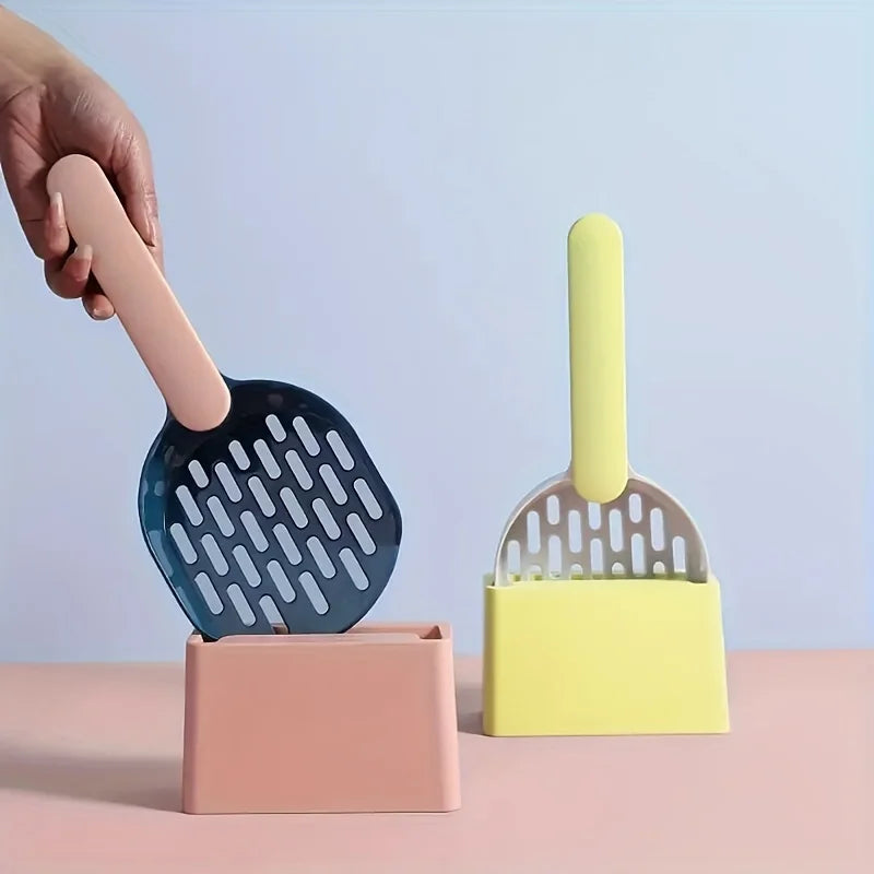 Two colorful pet scoops with stands on a pink surface against a light blue background
