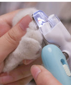 Pet nail trimmer being used on a small animal's paw