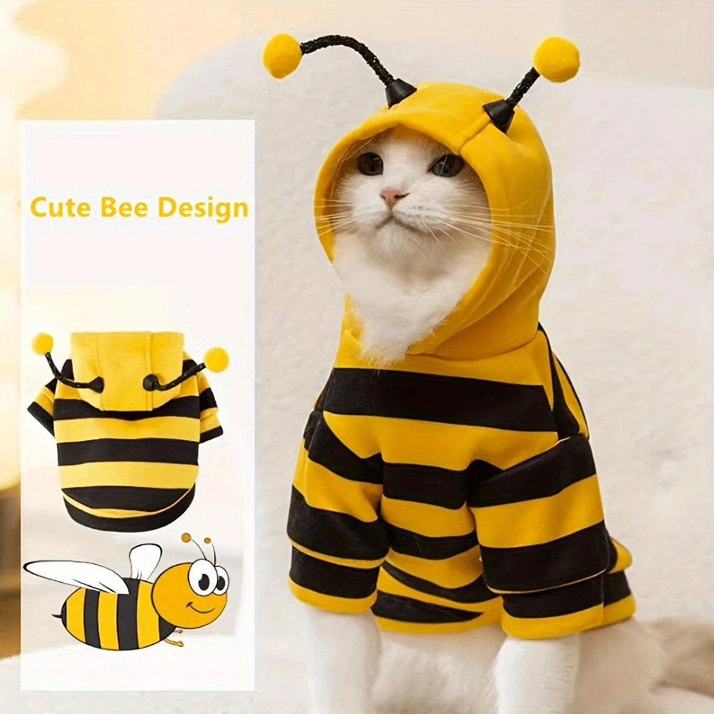 Cat wearing a bee-themed costume with a small inset of the costume design.