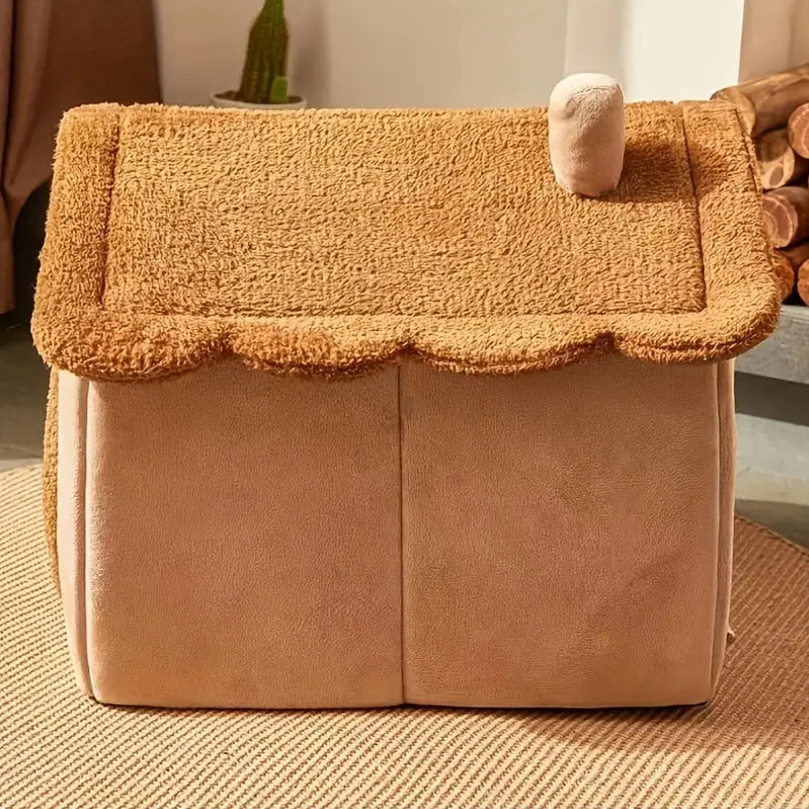 Brown plush dog house with a fluffy roof on a carpeted floor.