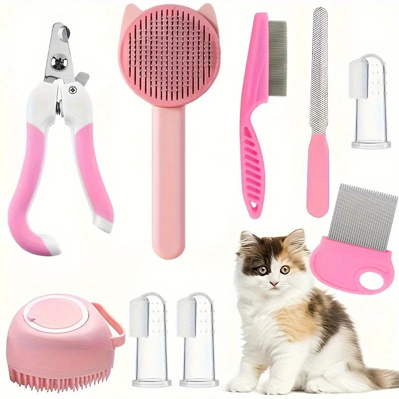 Set of pink pet grooming tools with a cat sitting below them on a white background.
