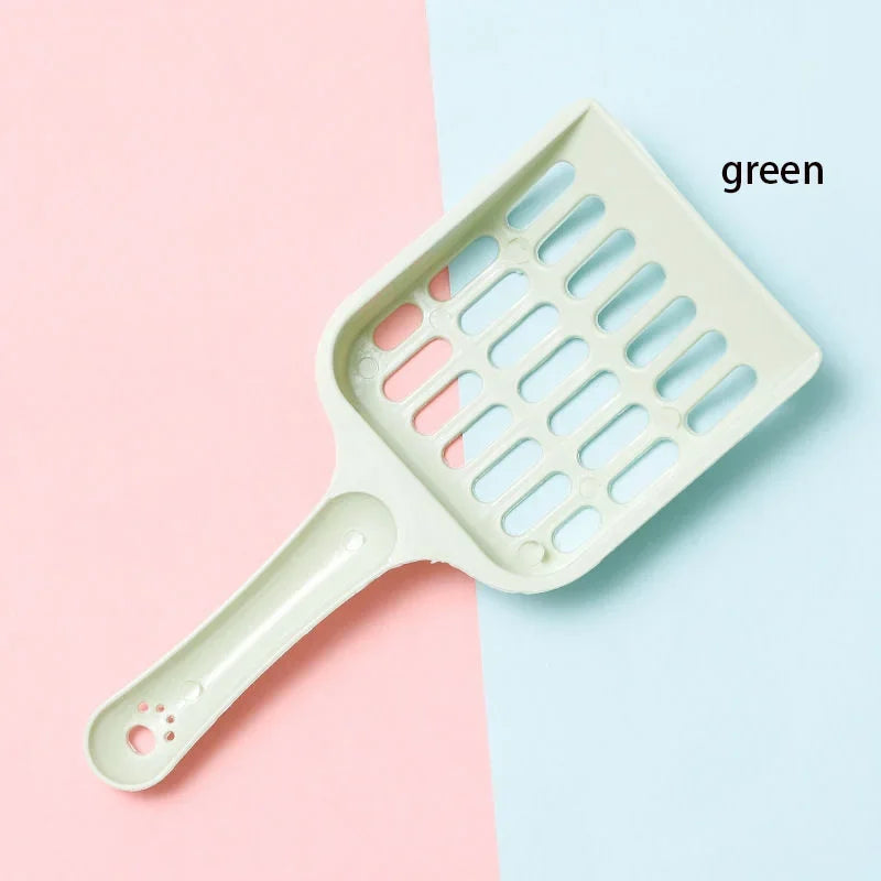 Green pet grooming tool on a pink and blue background