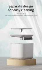 White kitchen appliance with a beige base on a light background, featuring text about easy cleaning.