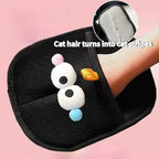 Black pet grooming tool with cartoon character design on a pink background