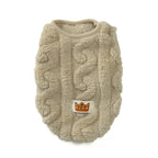 Beige cable knit dog sweater with a brand logo on a white background
