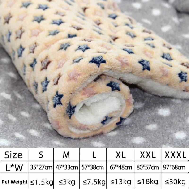 Roll of star-patterned fabric on a gray surface with size chart below.