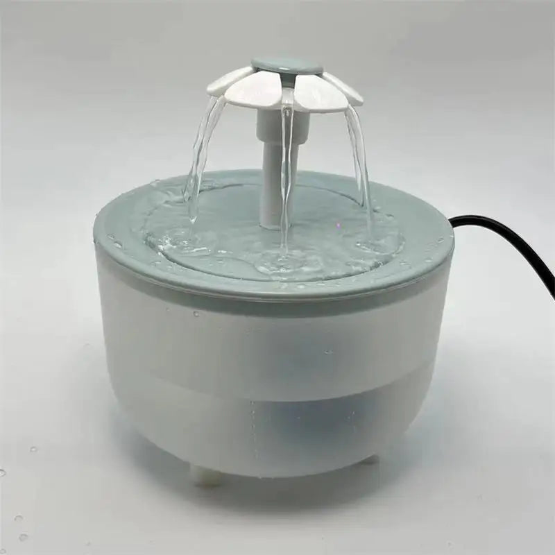 Small water fountain on a light gray background