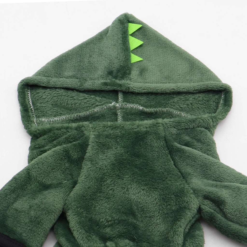 Green dinosaur-themed hooded towel on a white background