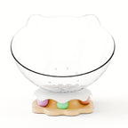 Glass bowl with a decorative base featuring colorful stones on a white background